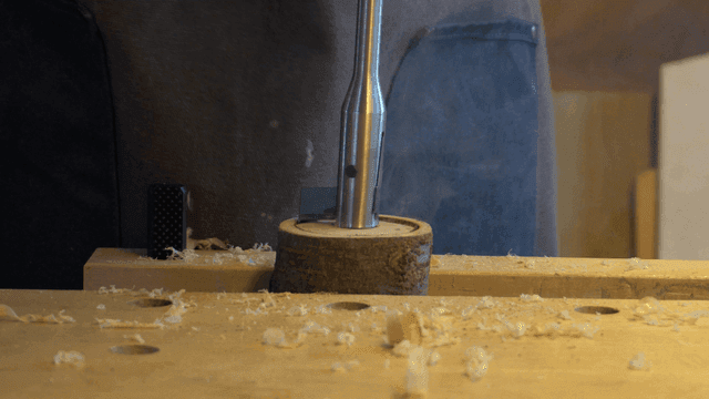 Drilling wood on a workbench