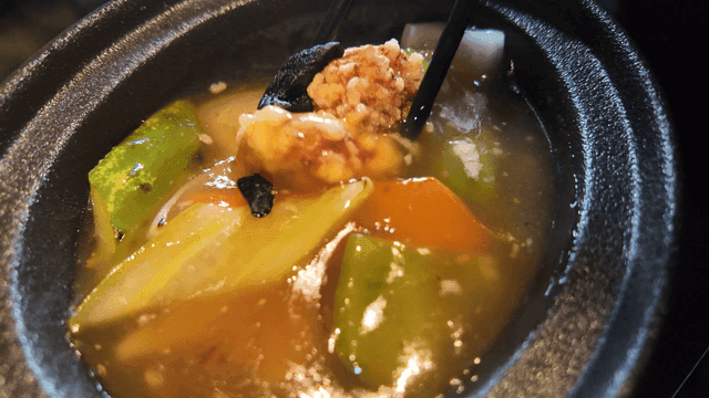 Black garlic tangsuyuk dipped generously in sauce