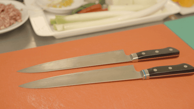 Ingredients and knife on cutting board