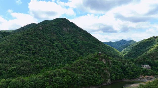 Green mountains under a clear sky