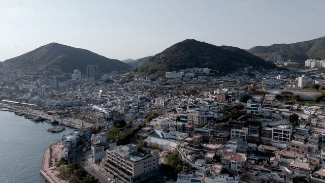 Coastal city with surrounding hills