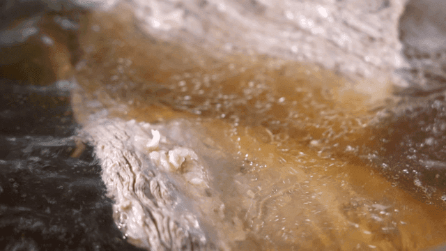 Boiling beef in a rich broth
