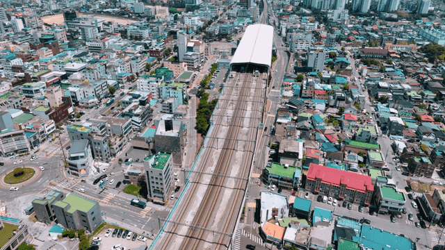 Aerial view of a city with railway tracks
