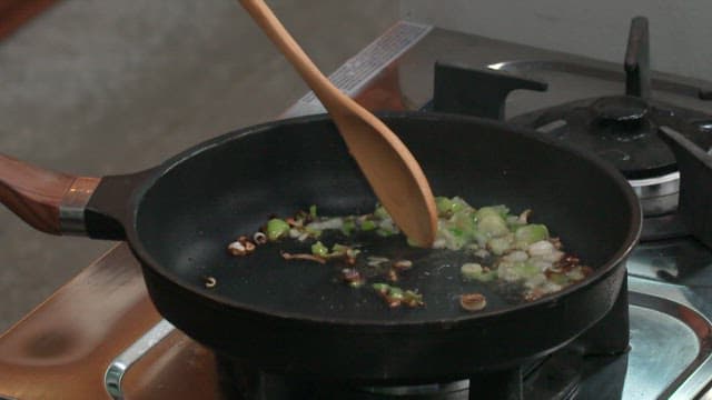 Tomatoes and Carrots Being Stir-fried on Green Onion Oil