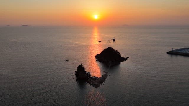 Sunset over the Sunset with the Silhouette of a Small Island