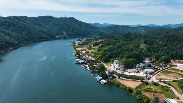 Cozy Rural Village along the River Below the Mountain