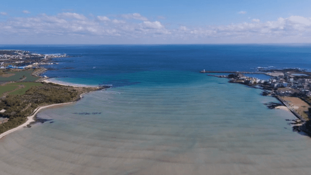 Serene coastal landscape with clear waters