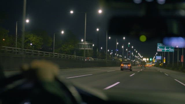 Nighttime Drive on a Well-Lit Highway