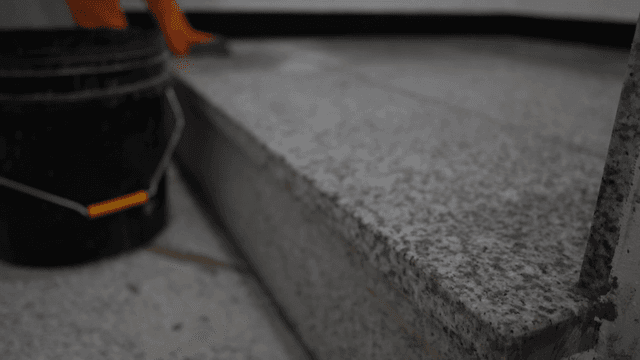Cleaning granite steps with mop