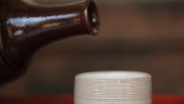 Pouring traditional Korean liquor into a cup