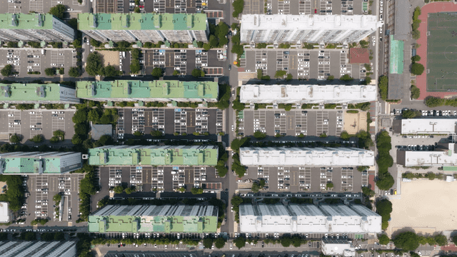 Aerial view of apartment complex and parking
