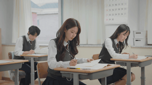 Students taking an exam in a classroom