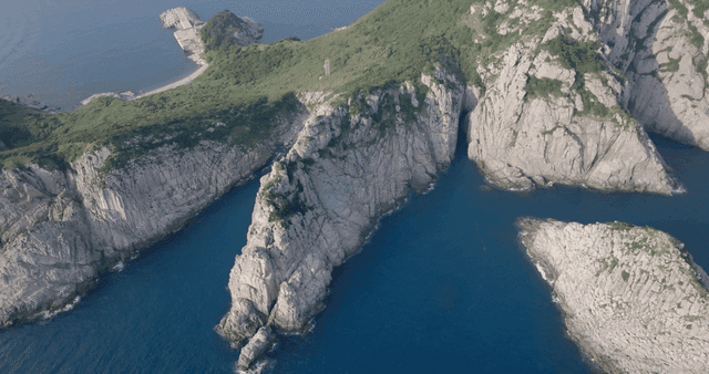 Rocky island surrounded by blue sea