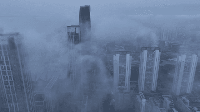 Foggy cityscape with tall buildings