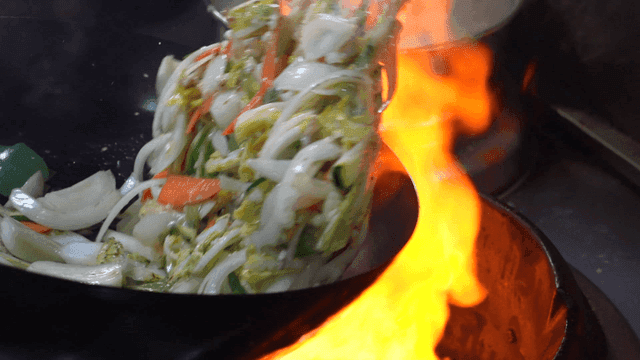 Vegetables stir-fried in wok