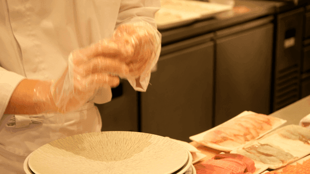 Chef preparing sushi with precision