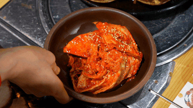 Kimchi being served at a dining table
