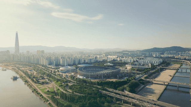 A sprawling cityscape with a stadium