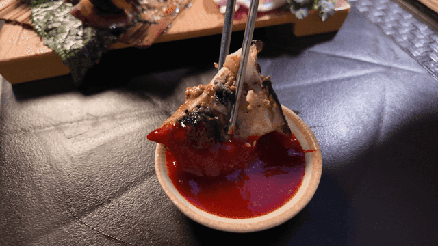 Whole steamed cuttlefish dipped in red chili sauce