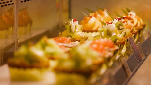 Gourmet Fruit Tartlets in a Bakery Display