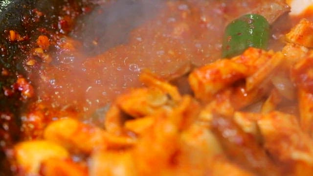 Grilled marinated beef tripe with vegetables and mushrooms