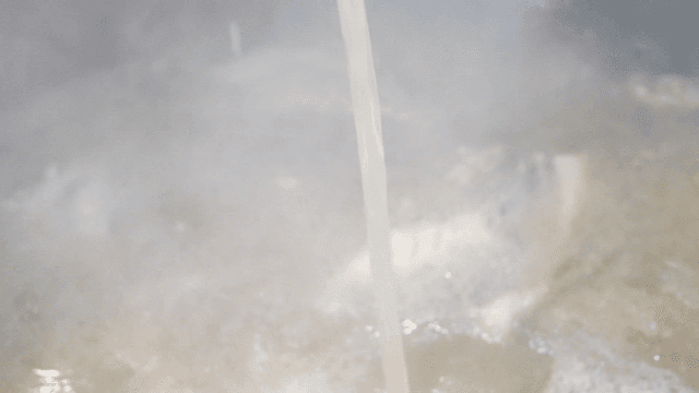 Broth poured into pot with meat