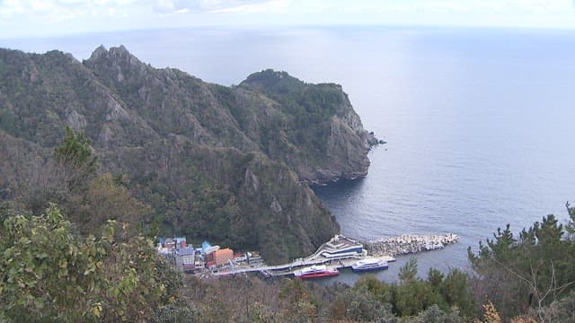 Coastal Village Nestled beneath Coastal Cliffs