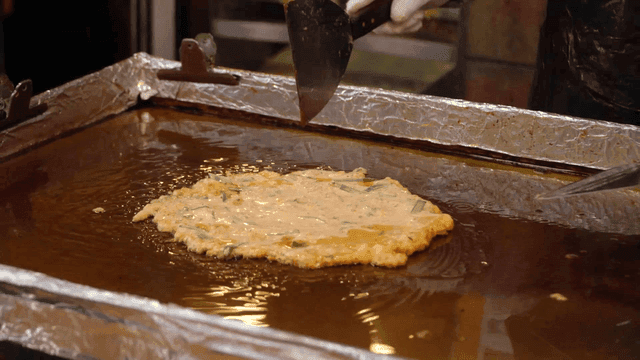 Mung bean pancakes fried on iron plate