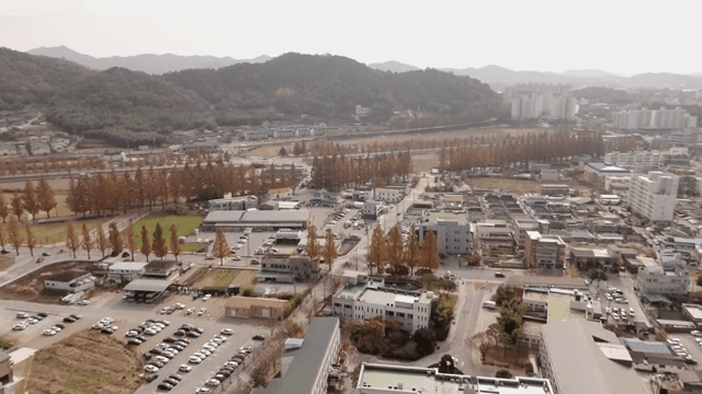 Aerial view of a village with autumn trees