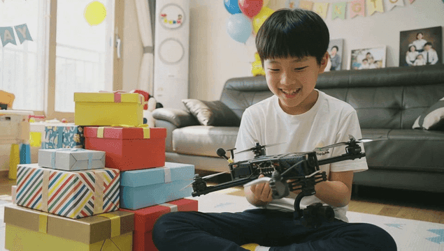 Child playing with drone on their birthday