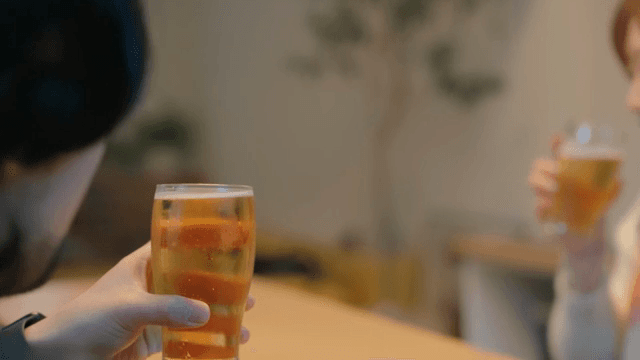 Friends toasting while enjoying beer together