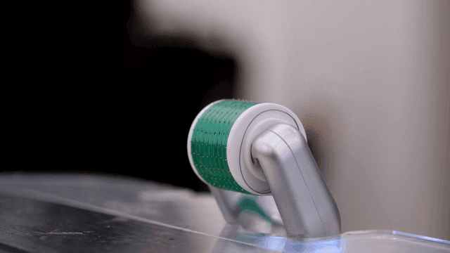 Close-up of a microneedle roller on a table