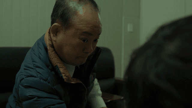 A man arm wrestling with determination