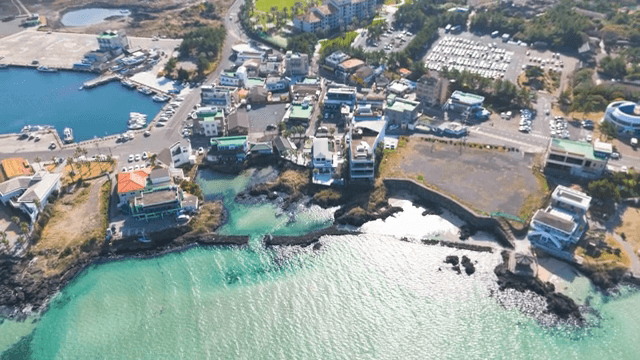Coastal town with clear waters and buildings