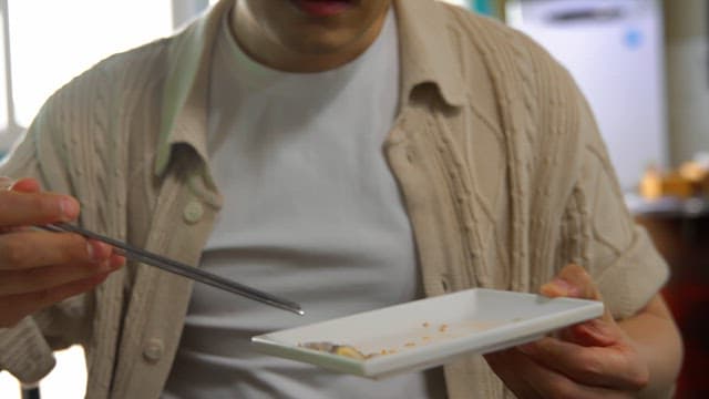 Man enjoying a meal indoors