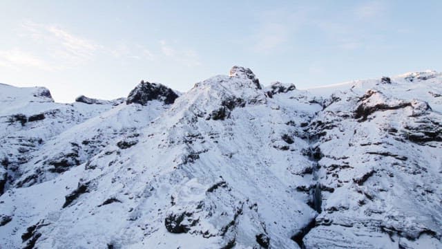 Snow-covered mountains under a clear sky