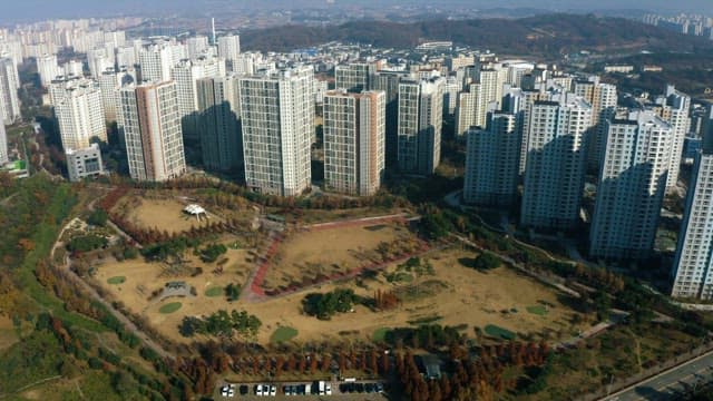 Apartment Complex and Park in Midday