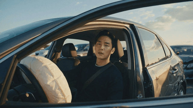 Man in a car with deployed airbag