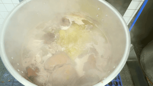 Large pot of boiling broth