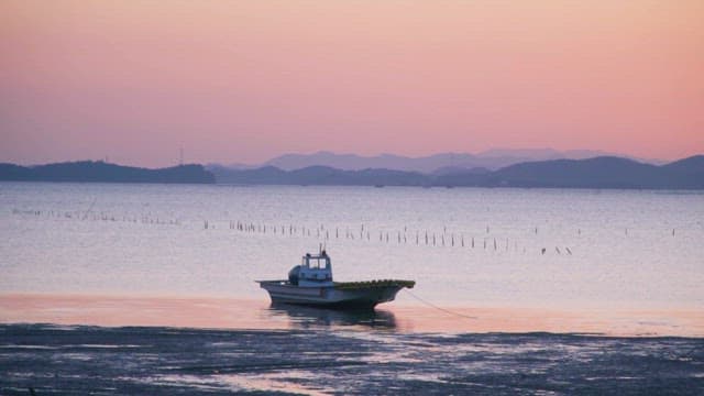 Boat on the Mudflats of Suncheon at Sunset