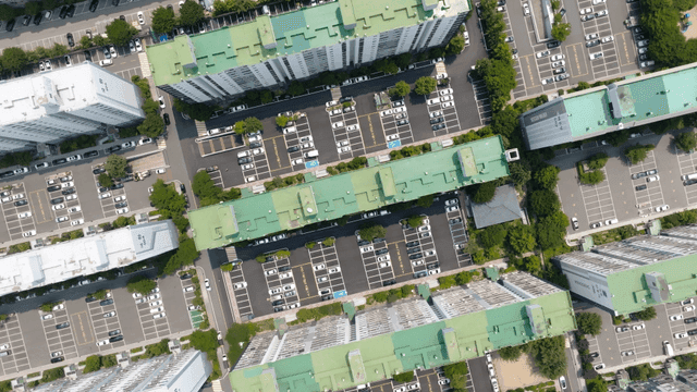 Symmetrical apartment rooftop and parking lot