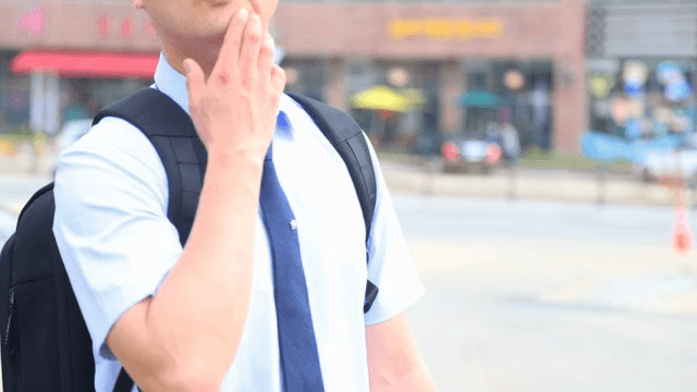 A businessman in shirt with a backpack