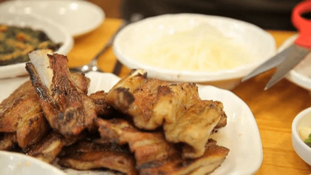Charcoal-grilled galbi on a white plate