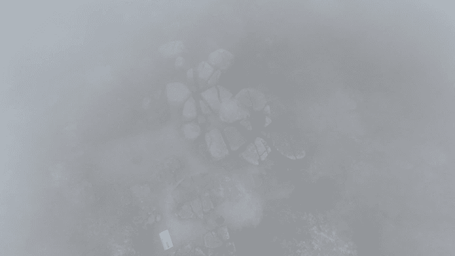 Foggy mountain with large rocks
