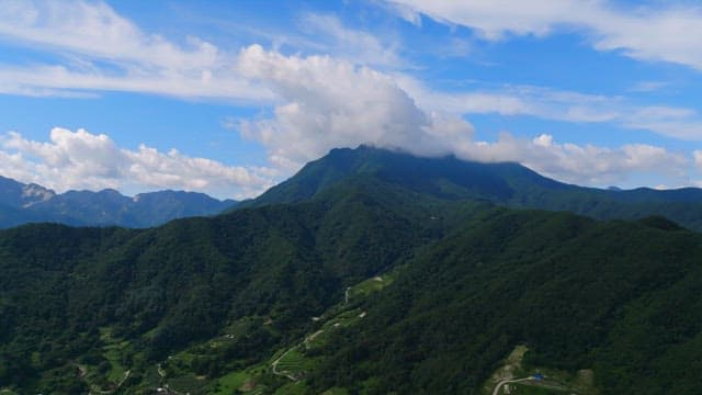 Vast mountain landscape under a blue sky