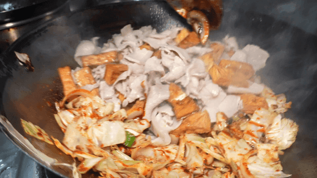 Jeyuk-bokkeum, where vegetables and meat are stir-fried in wok