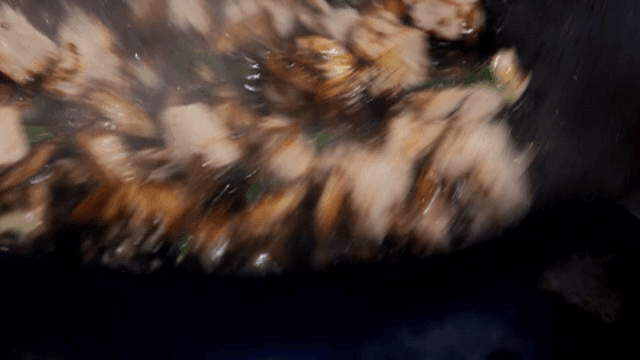 Meat and vegetables being stir-fried with Black Bean Paste