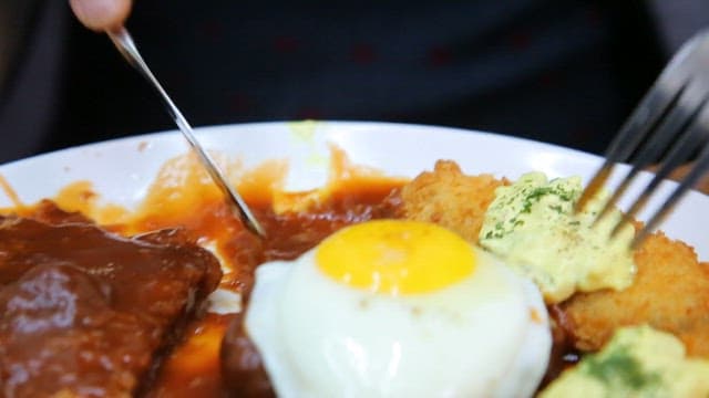 Plate of assorted pork cutlets and fried egg