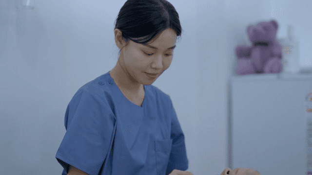 A nurse preparing a patient for a procedure
