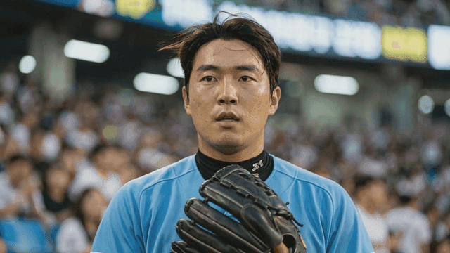 Baseball player concentrating in crowded stadium